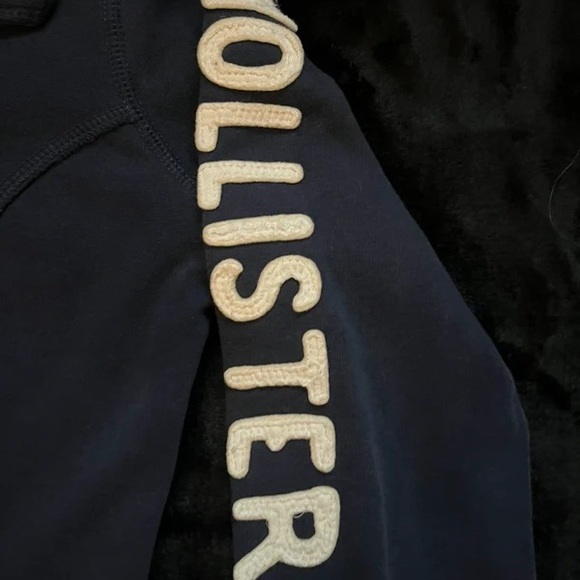 Hollister Tops - Hollister Dark Blue Top with Beige Lettering